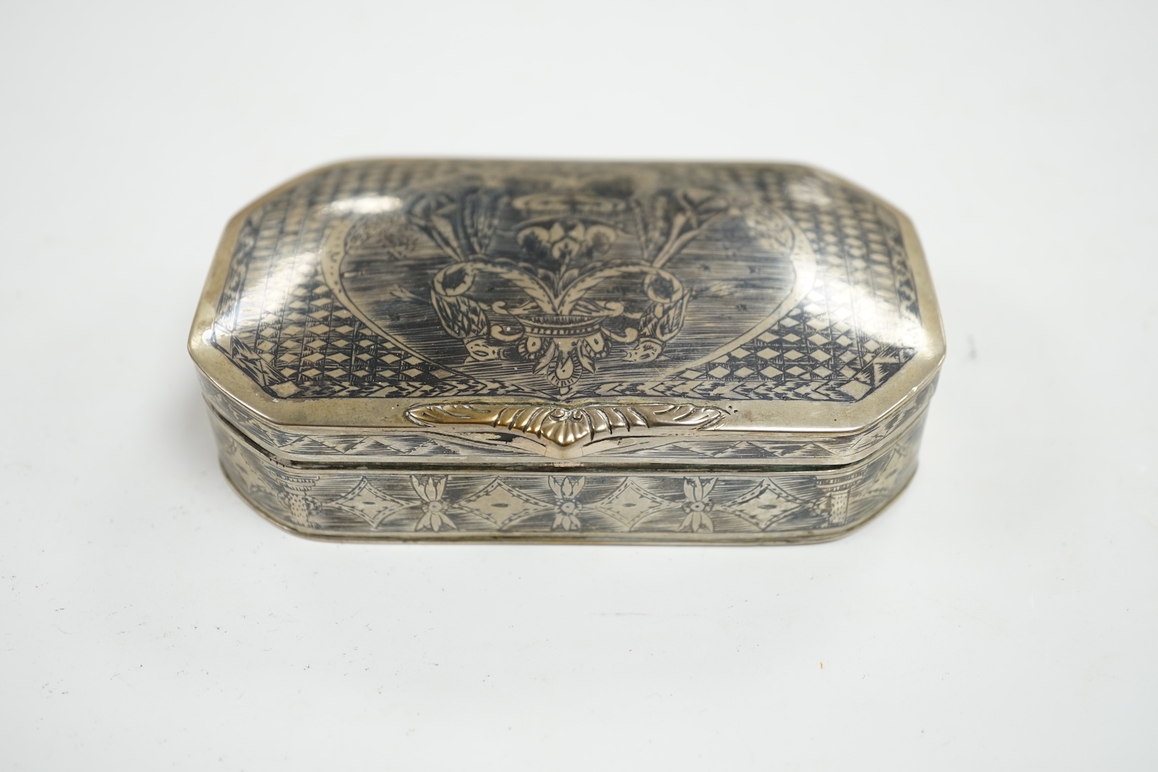 A continental white metal and niello octagonal box, 10.9cm. Condition - poor to fair